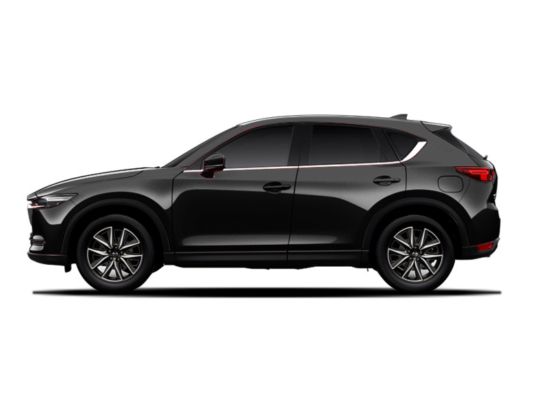 Черная mazda cx-9 припаркована на темной улице ночью.